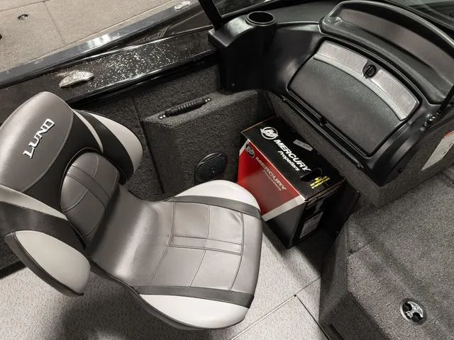 Slide: The Image of 2025 Lund 2075 Fisherman Sport interior with seat and Mercury box. - 17