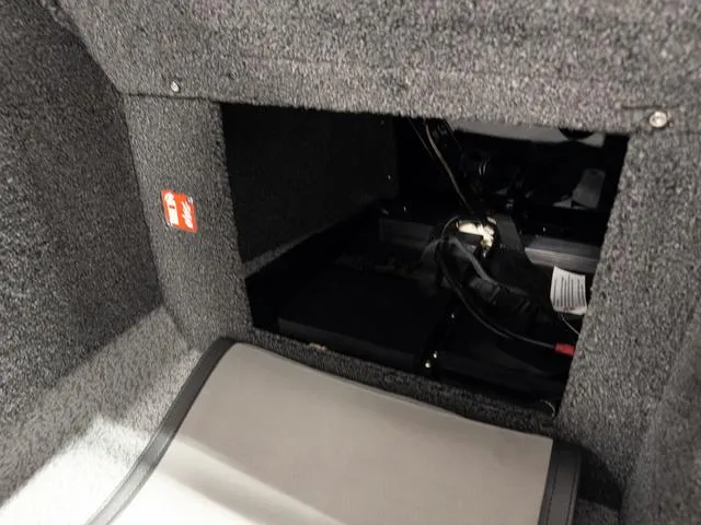 Slide: The Image of Interior compartment of 2025 Lund 2075 Fisherman Sport boat, showcasing storage space. - 18