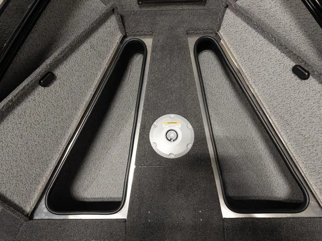 Slide: The Image of 2025 Lund 2075 Fisherman Sport interior storage compartments, gray carpeted finish. - 23