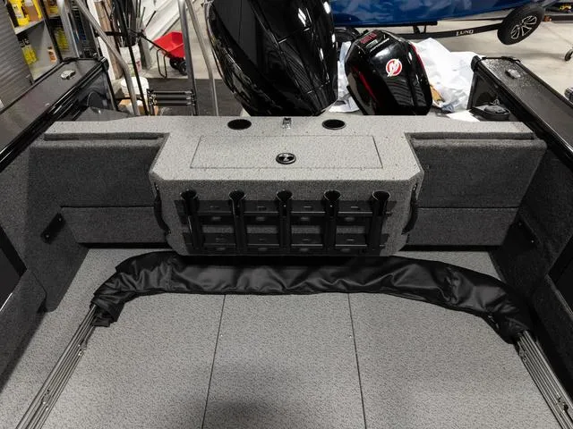 Slide: The Image of Fishing gear on a 2025 Lund 2075 Fisherman Sport boat, featuring rods and tools. - 4