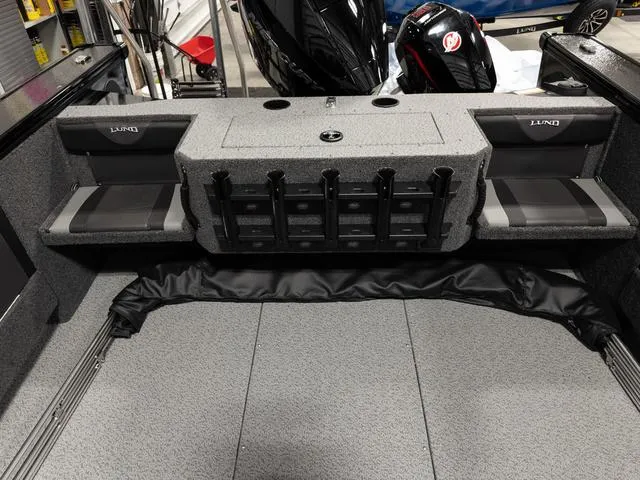 Slide: The Image of 2025 Lund 2075 Fisherman Sport boat interior with seating and storage compartments. - 5