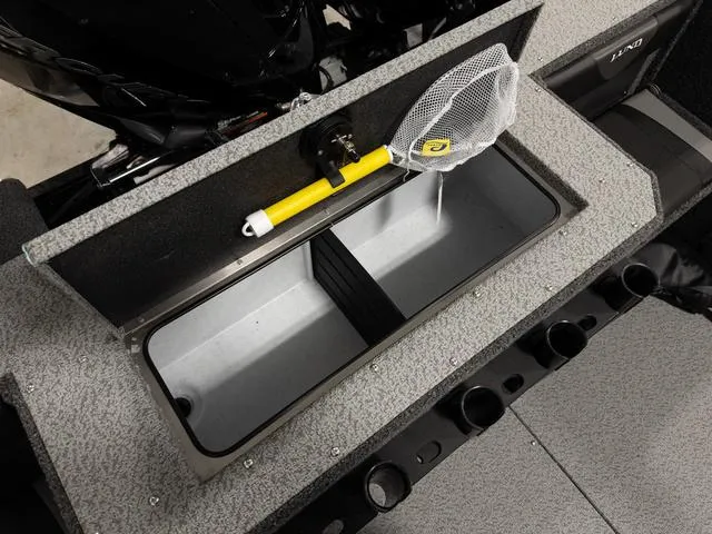 Slide: The Image of 2025 Lund 2075 Fisherman Sport boat livewell with net and rod holders. - 6