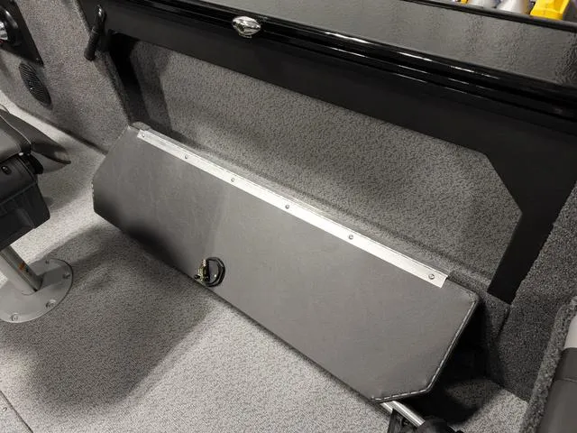 Slide: The Image of 2025 Lund 2075 Fisherman Sport interior with foldable seat and storage compartment. - 8
