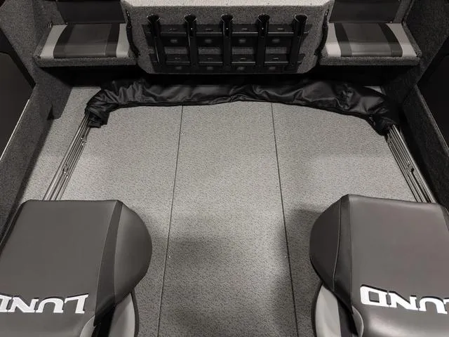 Slide: The Image of 2025 Lund 2075 Fisherman Sport interior with seating and storage compartments. - 9