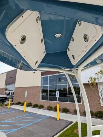 Slide: The Image of Control panel of 2025 Cobia 220 CC boat with various switches and warnings. - 20