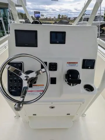 Slide: The Image of Storage compartment on 2025 Cobia 220 CC boat, open and empty. - 22