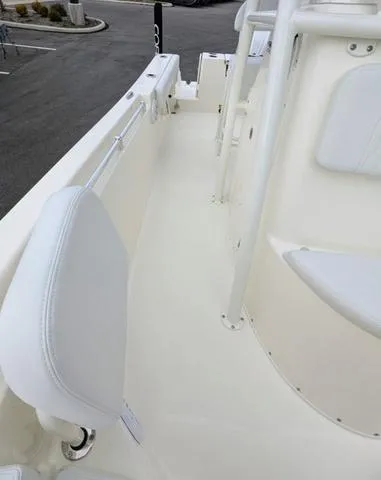 Slide: The Image of 2025 Cobia 220 CC boat interior with seating and speaker, showcasing modern design. - 31