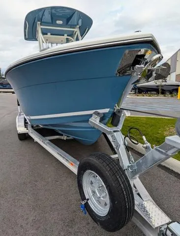 Slide: The Image of 2025 Cobia 220 CC boat at Buckeye Sports Center, rear view. - 5