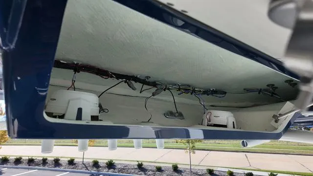 Slide: The Image of 2025 Cobia 265 CC boat interior wiring and components view. - 27