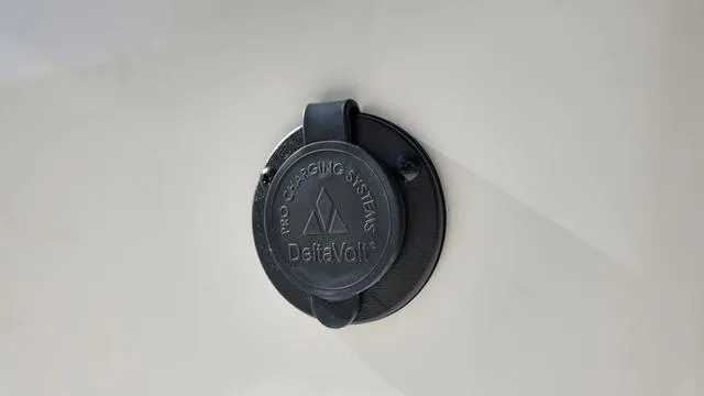 Slide: The Image of DeltaVolt charging port on 2025 Cobia 265 CC boat. - 28