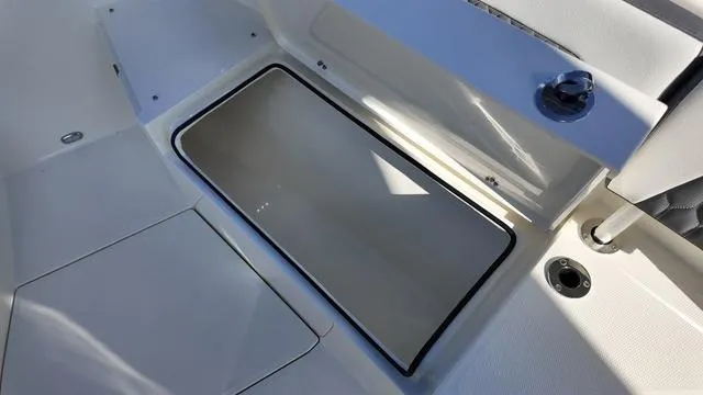 Slide: The Image of 2025 Cobia 265 CC boat interior with storage compartment. - 36
