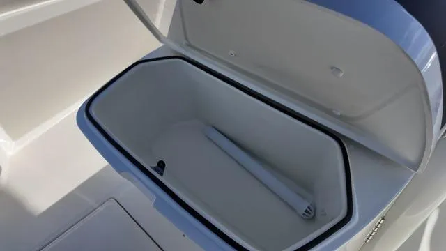 Slide: The Image of Open storage compartment on 2025 Cobia 265 CC boat. - 42