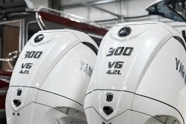 Slide: The Image of Twin Yamaha 300 V6 4.2L outboard engines on a 2025 Cobia 285 CC boat. - 37