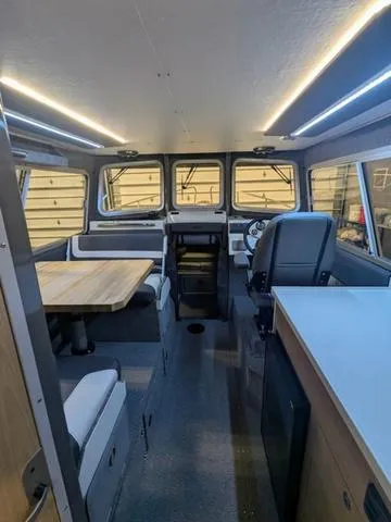Slide: The Image of Interior of 2025 Thunder Jet Pilot 26' boat with modern seating and navigation area. - 21