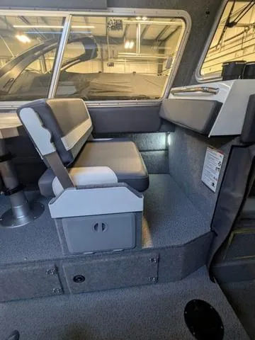 Slide: The Image of Interior of 2025 Thunder Jet Pilot 26' boat with seating and storage. - 25