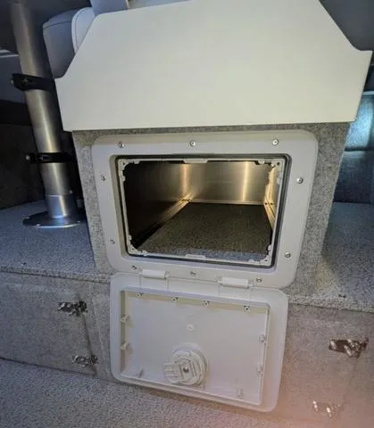 Slide: The Image of 2025 Thunder Jet Pilot 26' interior storage compartment with open hatch. - 30