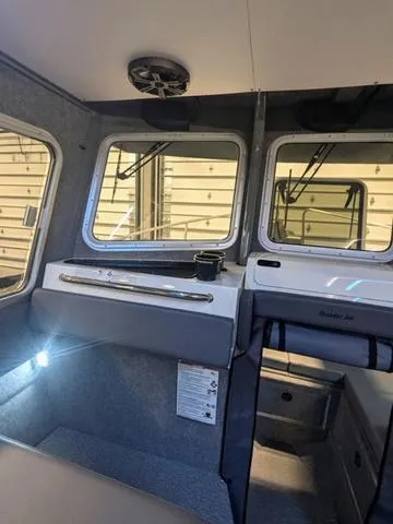 Slide: The Image of Interior of 2025 Thunder Jet Pilot 26' boat with modern design and spacious cabin. - 32
