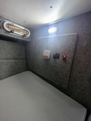 Slide: The Image of Interior cabin of 2025 Thunder Jet Pilot 26' boat with lighting and controls. - 37