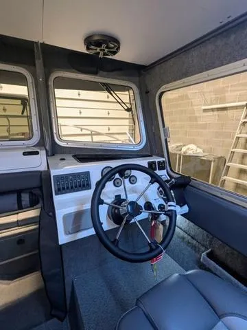 Slide: The Image of 2025 Thunder Jet Pilot 26' boat interior with steering wheel and control panel. - 40