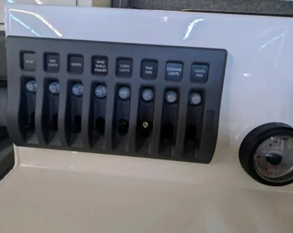 Slide: The Image of Control panel of 2025 Thunder Jet Pilot 26' boat with labeled switches. - 43