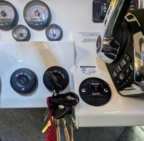 Slide: The Image of Control panel of 2025 Thunder Jet Pilot 26' boat with gauges and ignition keys. - 45