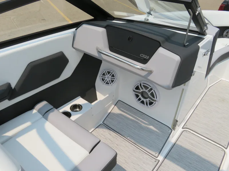 Slide: The Image of 2025 Cobalt CS23 boat interior with modern seating and speaker system. - 13