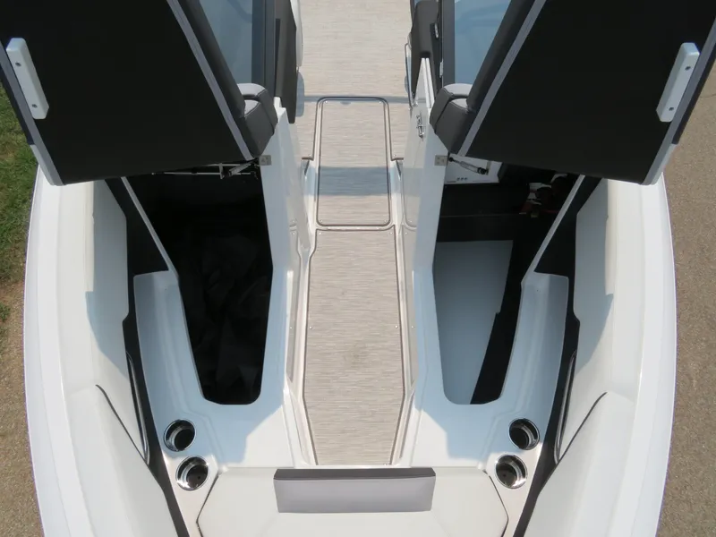 Slide: The Image of 2025 Cobalt CS23 boat interior with open storage compartments and sleek design. - 15