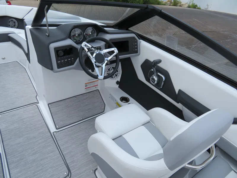 Slide: The Image of 2025 Cobalt CS22 boat interior with modern steering and dashboard design. - 10