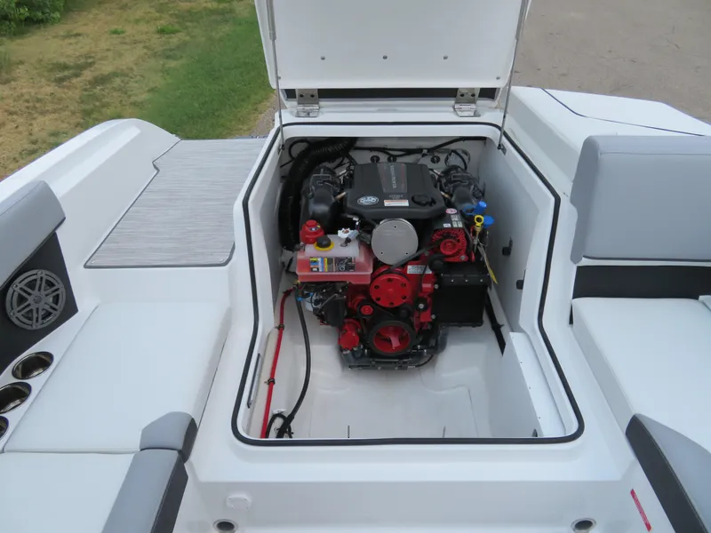 Slide: The Image of 2025 Cobalt CS22 boat engine compartment with open hatch, showcasing engine details. - 14