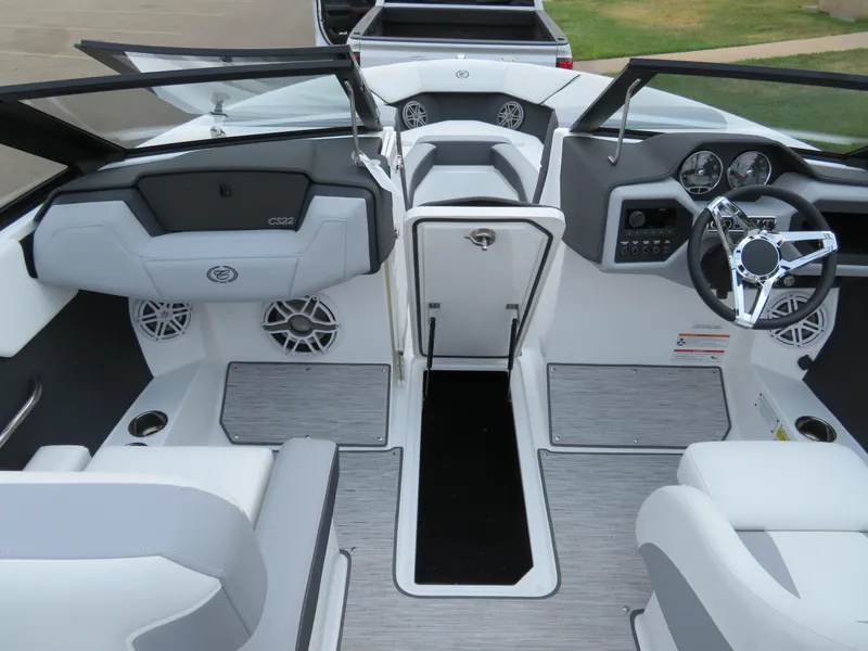 Slide: The Image of 2025 Cobalt CS22 boat interior with modern dashboard and seating. - 17