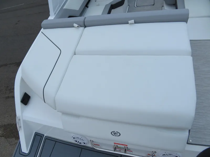Slide: The Image of 2025 Cobalt CS22 boat with white cushioned seating and sleek design. - 6