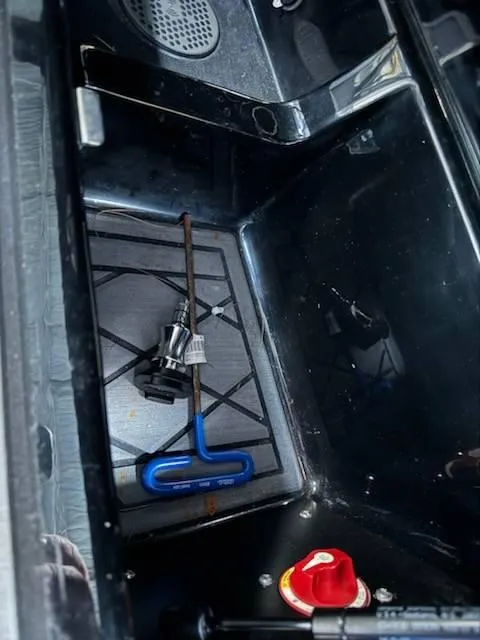 Slide: The Image of Interior of 2022 Tigé 23ZE boat with tools and components visible. - 24