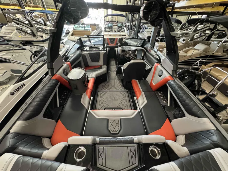 Slide: The Image of 2022 Tigé 23ZE boat interior with modern seating and sleek design. - 9