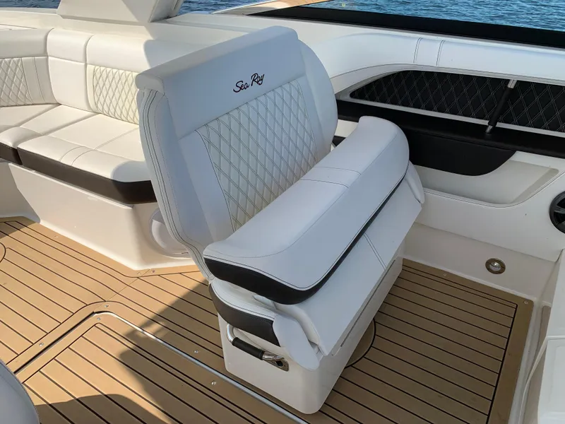 Slide: The Image of Luxurious 2019 Sea Ray SLX 310 boat interior with elegant seating and teak flooring. - 23
