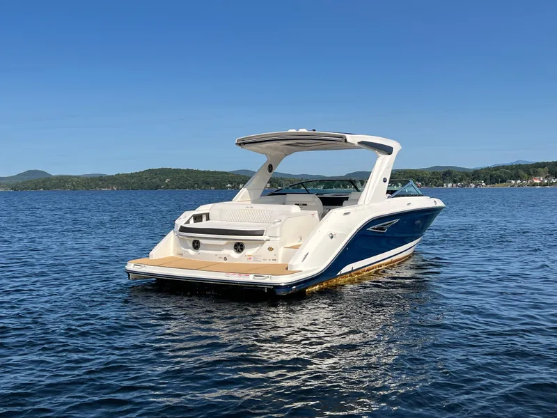 Slide: The Image of 2019 Sea Ray SLX 310 boat on a serene lake. - 41