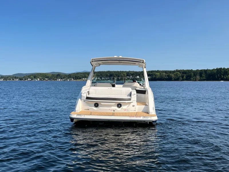 Slide: The Image of 2019 Sea Ray SLX 310 boat on a serene lake. - 43