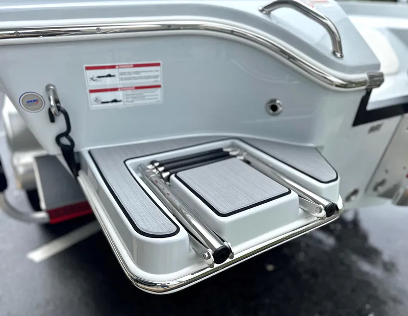 Slide: The Image of 2025 Pathfinder 2600 HPS boat swim platform with retractable ladder and safety features. - 15