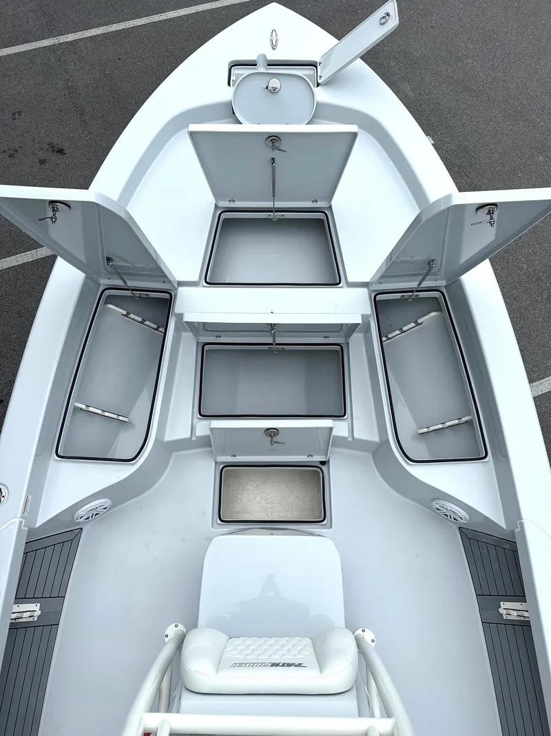Slide: The Image of 2025 Pathfinder 2600 HPS boat with open storage compartments, top view. - 21