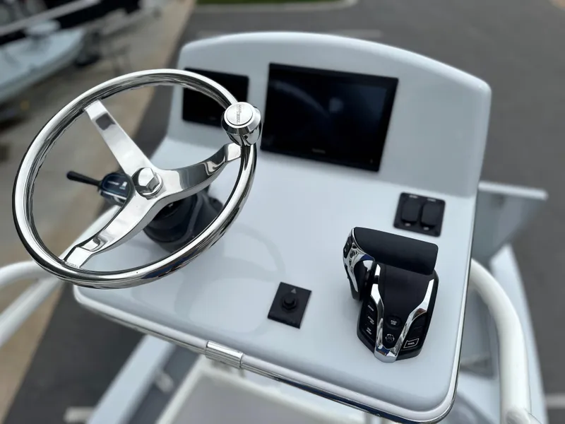 Slide: The Image of Pathfinder 2600 HPS 2025 boat console with steering wheel and controls. - 22