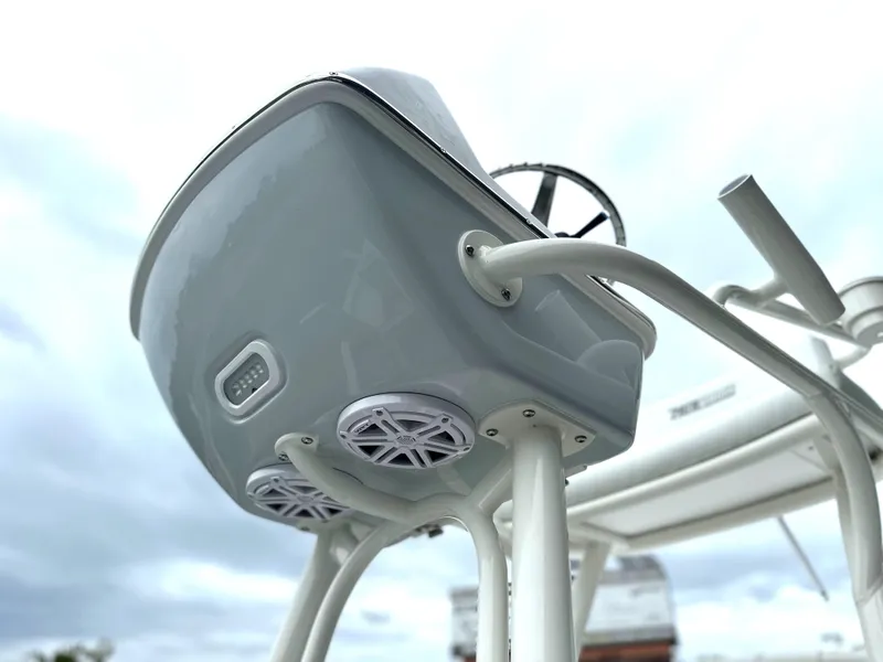 Slide: The Image of 2025 Pathfinder 2600 HPS boat console with speakers and steering wheel. - 23