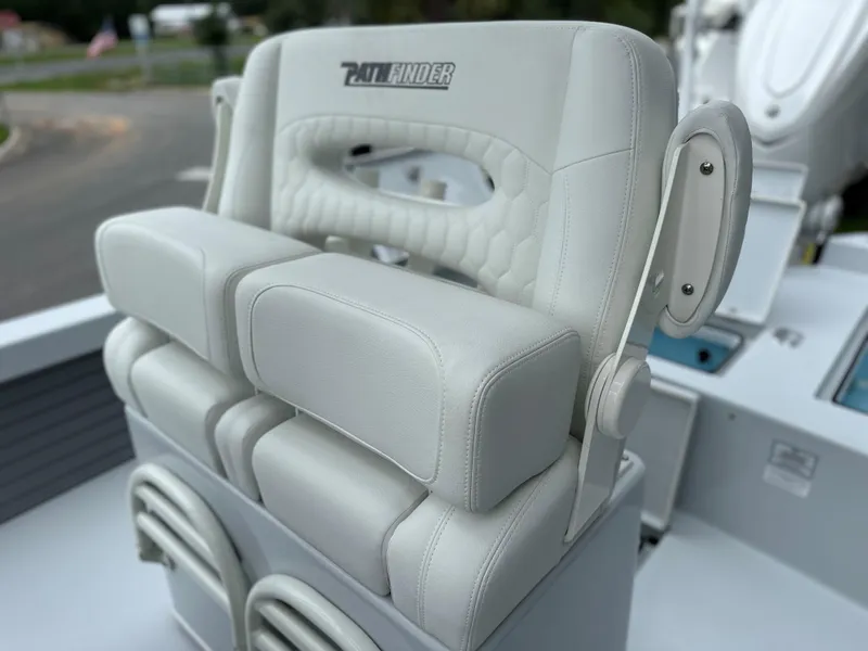 Slide: The Image of 2025 Pathfinder 2600 HPS boat seat with cushioned armrests and sleek design. - 25
