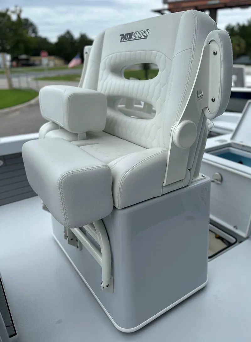 Slide: The Image of White captain's chair on 2025 Pathfinder 2600 HPS boat, featuring cushioned armrests and sleek design. - 26