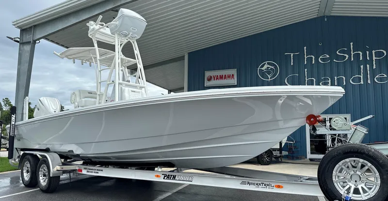 Slide: The Image of 2025 Pathfinder 2600 HPS boat on trailer at dealership, side view. - 27