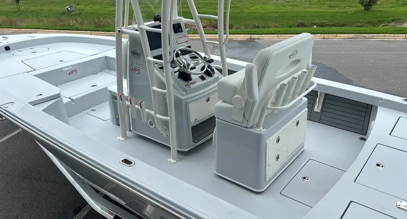 Slide: The Image of 2025 Pathfinder 2600 HPS boat interior with steering console and seating. - 9