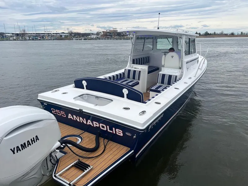 Slide: The Image of 2025 Steiger Craft 255 Annapolis boat with Yamaha engine on calm water. - 10