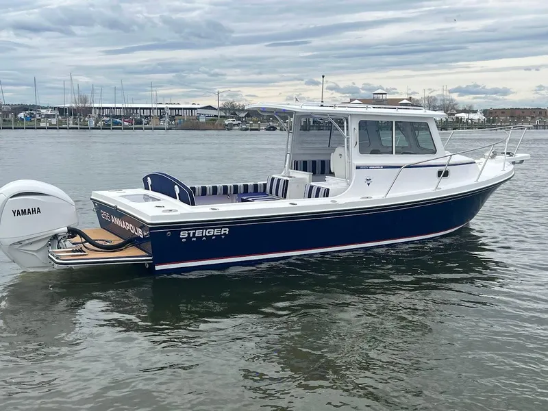 Slide: The Image of 2025 Steiger Craft 255 Annapolis boat on water, featuring Yamaha engine. - 11