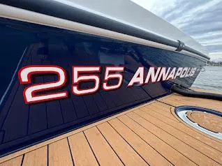 Slide: The Image of 2025 Steiger Craft 255 Annapolis boat with sleek design and wooden deck. - 14