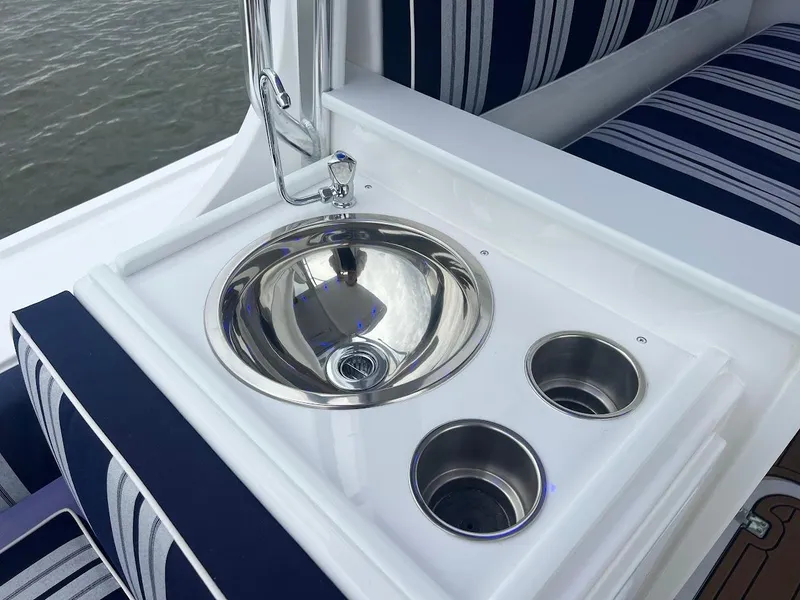 Slide: The Image of 2025 Steiger Craft 255 Annapolis boat sink with striped seating. - 26
