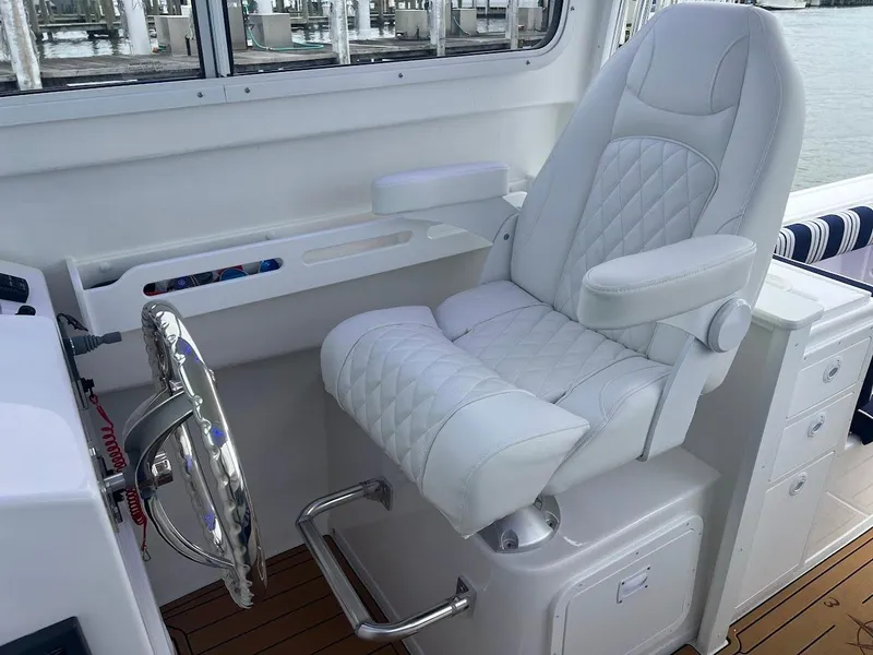 Slide: The Image of Luxurious helm seat in 2025 Steiger Craft 255 Annapolis boat interior. - 32