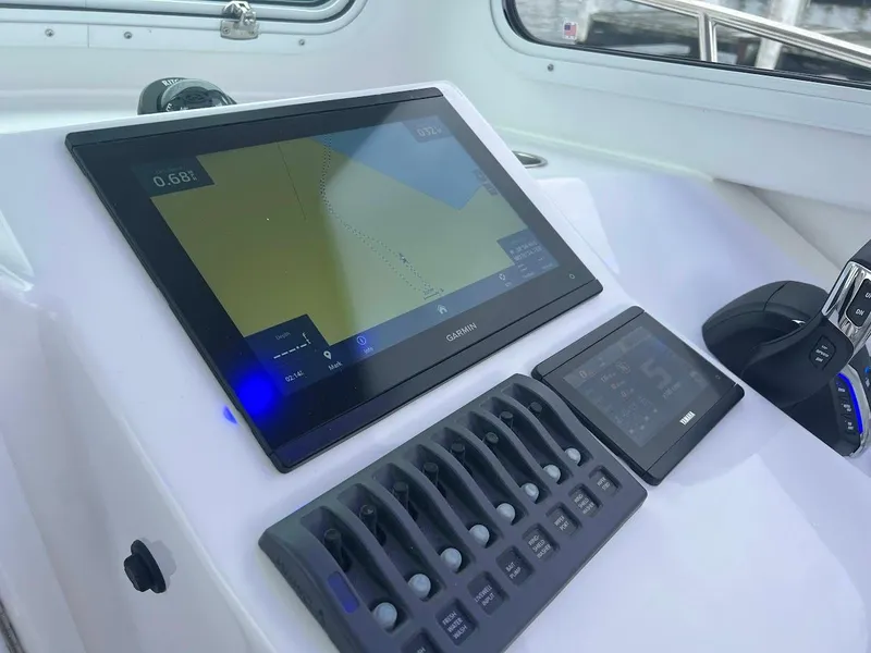 Slide: The Image of Steiger Craft 255 Annapolis 2025 dashboard with navigation display and controls. - 36